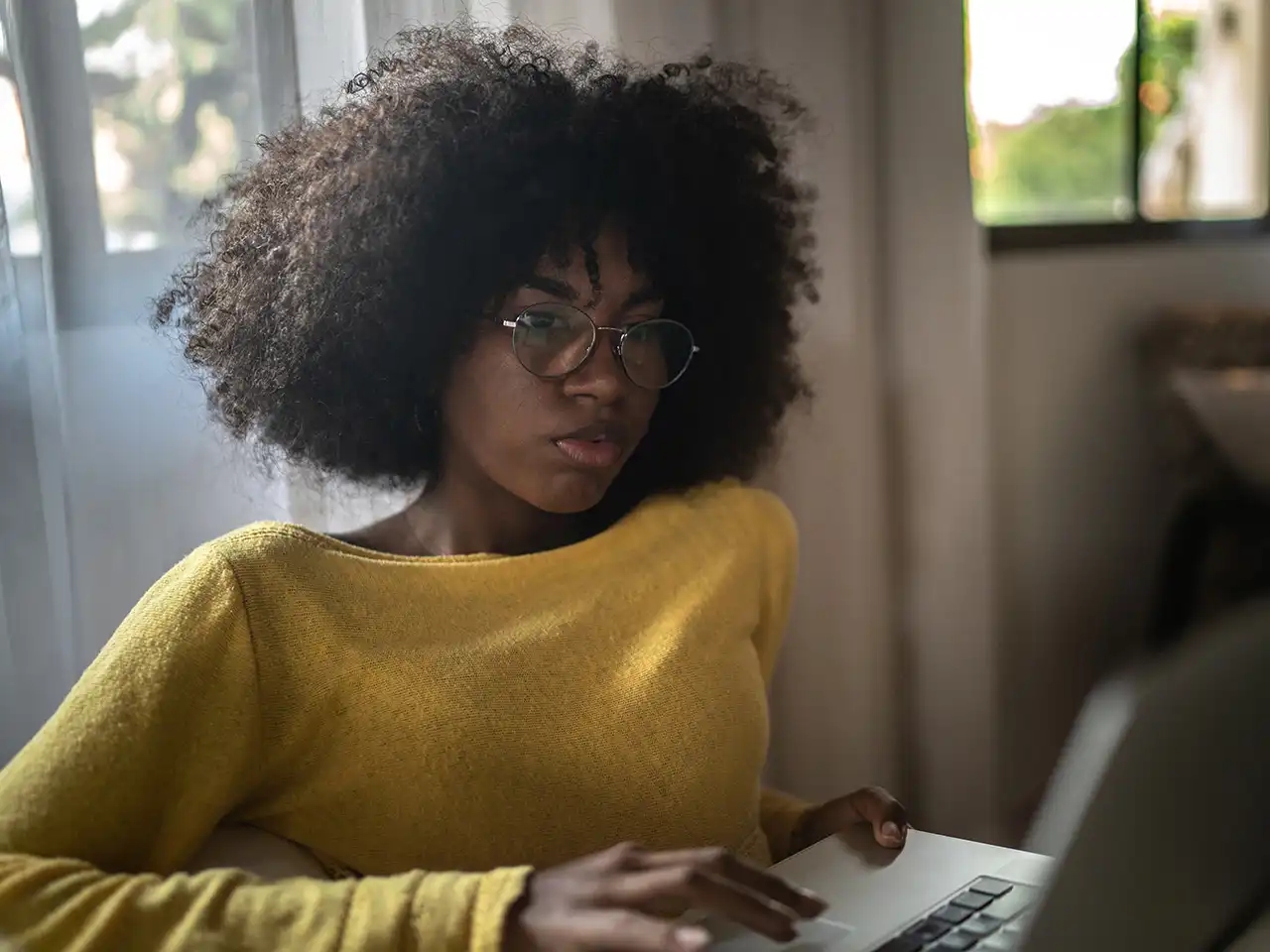 Woman works on laptop